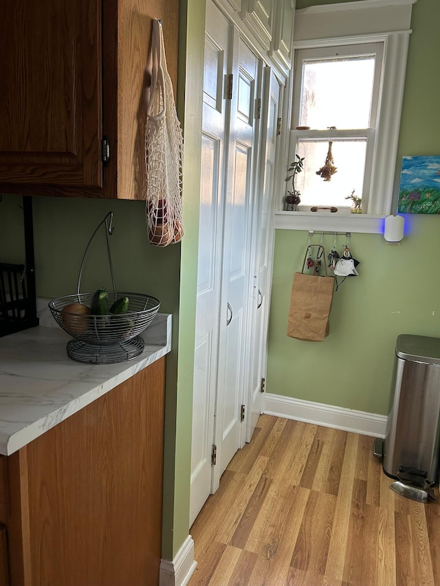 1636 Minnehaha Ave W, Saint Paul, MN 55104 - laundry room featuring light wood-type flooring and baseboards