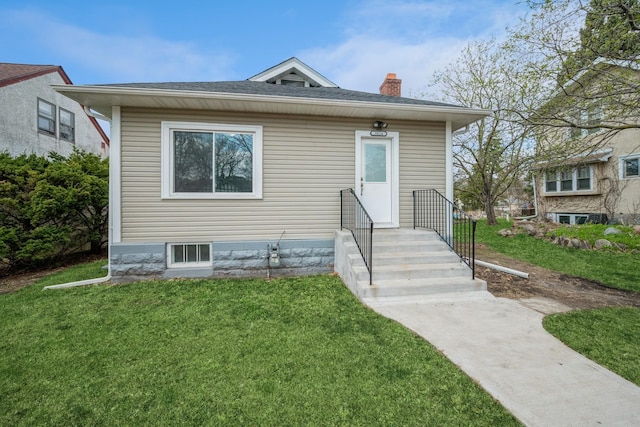3624 15th Ave S, Minneapolis, MN 55407 - view of front facade with a chimney and a front lawn