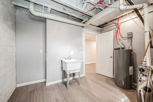 3624 15th Ave S, Minneapolis, MN 55407 - finished basement featuring electric water heater, light wood finished floors, and concrete block wall