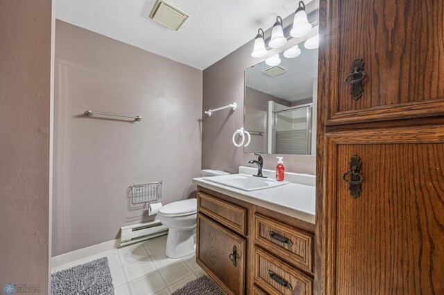 3402 Par St N, Fargo, ND 58102 - bathroom featuring a baseboard radiator, vanity, a shower with shower door, and tile patterned floors