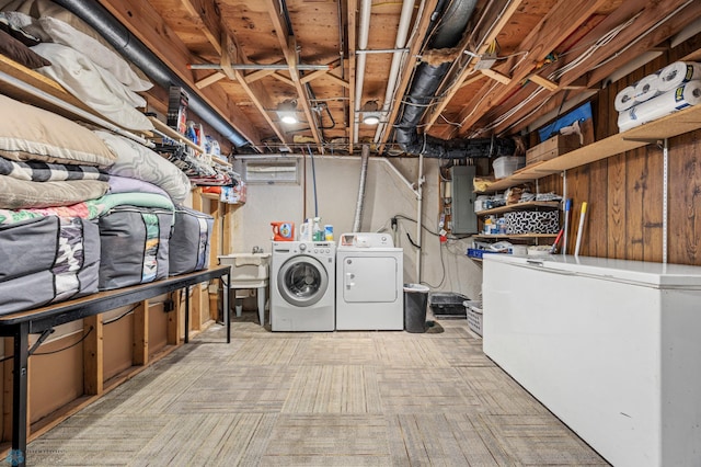 3402 Par St N, Fargo, ND 58102 - unfinished basement featuring washer and dryer, fridge, electric panel, and carpet floors
