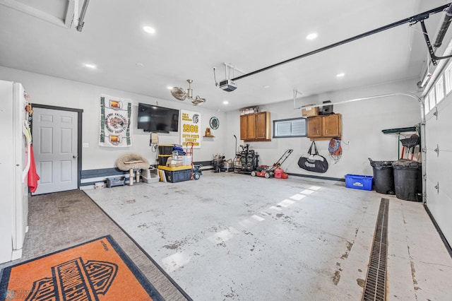 3402 Par St N, Fargo, ND 58102 - garage featuring a garage door opener and recessed lighting