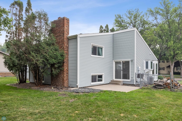 3402 Par St N, Fargo, ND 58102 - back of house with a chimney and a patio