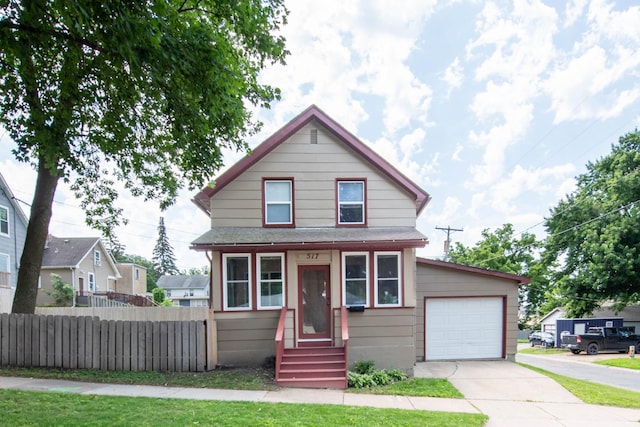 517 Elm St, Mankato, MN 56001 - traditional style home featuring driveway, a garage, and entry steps