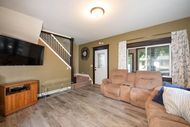 517 Elm St, Mankato, MN 56001 - living room featuring stairway and wood finished floors