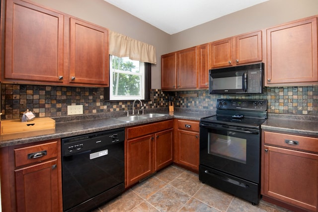 517 Elm St, Mankato, MN 56001 - kitchen with black appliances, dark countertops, backsplash, and brown cabinets