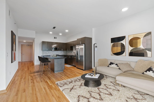 1240 2nd St Unit 225, Minneapolis, MN 55415 - living area with light wood finished floors and recessed lighting