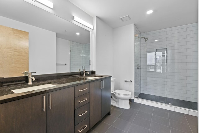 1240 2nd St Unit 225, Minneapolis, MN 55415 - full bathroom with double vanity, tile patterned flooring, tiled shower, and recessed lighting