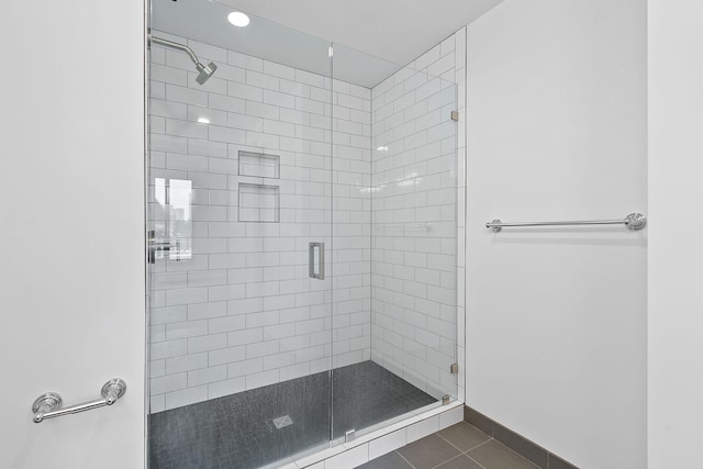 1240 2nd St Unit 225, Minneapolis, MN 55415 - bathroom featuring a stall shower, tile patterned flooring, and recessed lighting