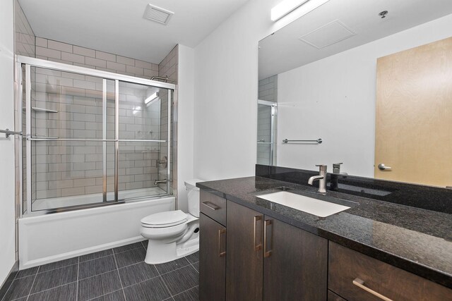 1240 2nd St Unit 225, Minneapolis, MN 55415 - full bath with vanity, shower / bath combination with glass door, and tile patterned flooring