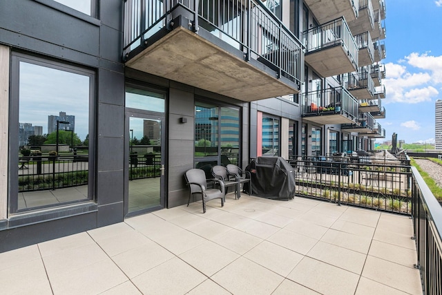 1240 2nd St Unit 225, Minneapolis, MN 55415 - view of patio / terrace featuring a grill and a view of city