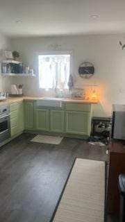 421 8th St, Cloquet, MN 55720 - kitchen with green cabinetry and light countertops