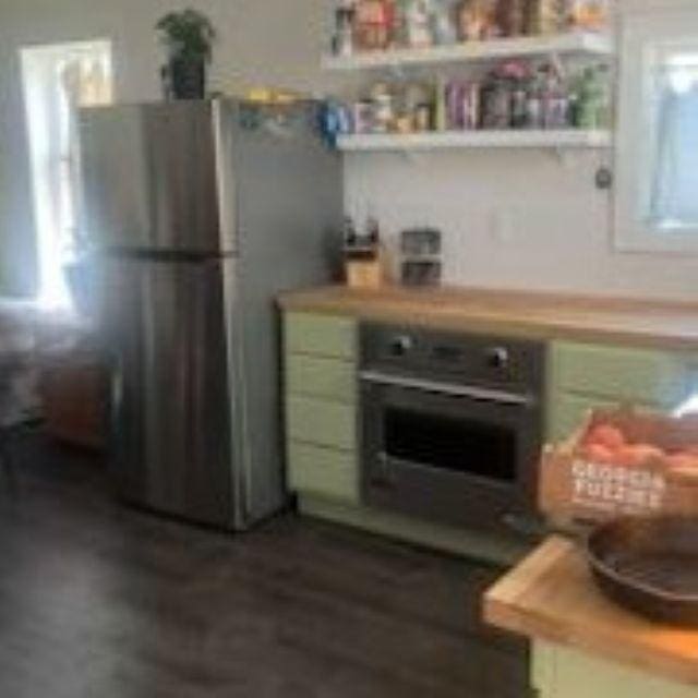 421 8th St, Cloquet, MN 55720 - kitchen with freestanding refrigerator, oven, plenty of natural light, and light countertops