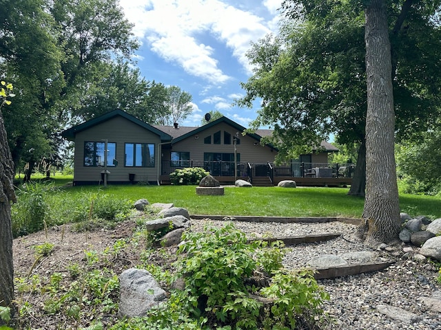 7443 Walleye Ln SW, Alexandria, MN 56308 - back of house with a wooden deck and a yard