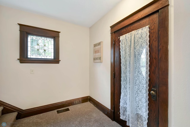 51 6th Ave N, Fargo, ND 58102 - carpeted entrance foyer featuring baseboards and stairway