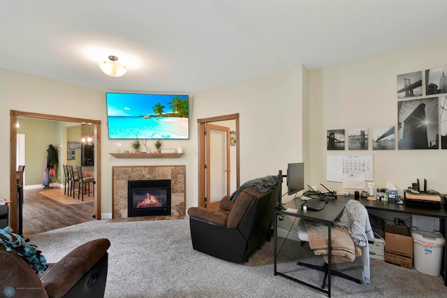 51 6th Ave N, Fargo, ND 58102 - carpeted living area with an office area and a tiled fireplace