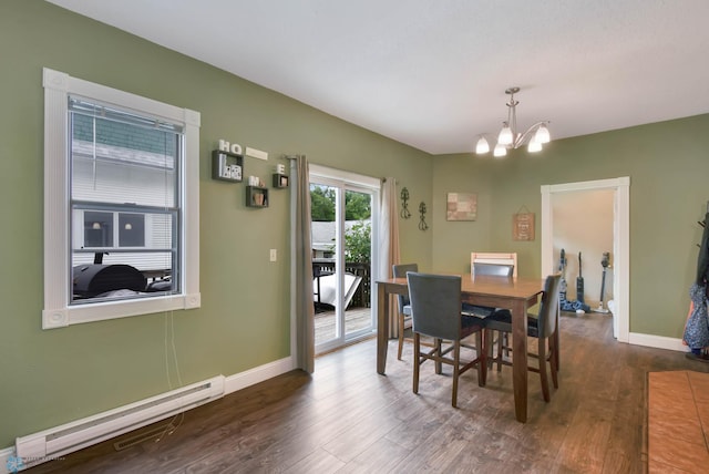 51 6th Ave N, Fargo, ND 58102 - dining room with a chandelier, a baseboard radiator, and dark wood-style floors
