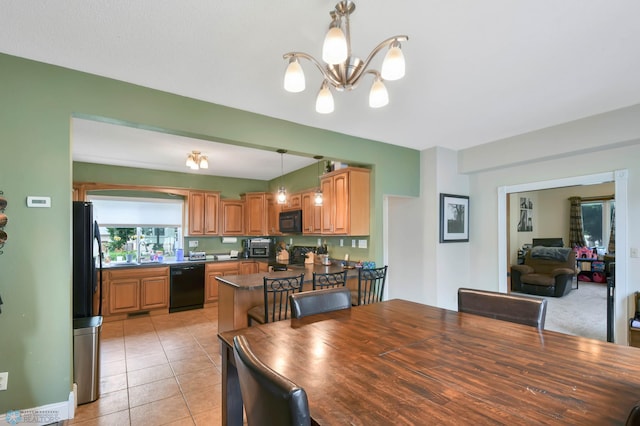 51 6th Ave N, Fargo, ND 58102 - dining space with a chandelier and light tile patterned floors