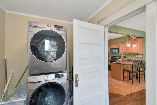 51 6th Ave N, Fargo, ND 58102 - laundry room with stacked washing machine and dryer, wood finished floors, crown molding, and a textured ceiling