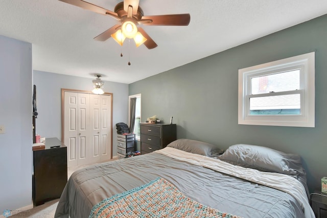 51 6th Ave N, Fargo, ND 58102 - bedroom featuring a closet, light colored carpet, and ceiling fan