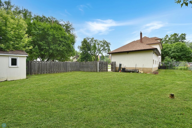 51 6th Ave N, Fargo, ND 58102 - fenced backyard with an outbuilding