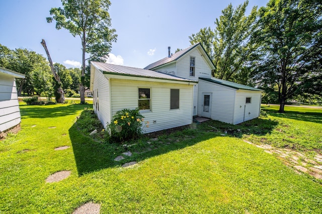 415 Minnesota Ave S, Oronoco, MN 55960 - back of house with a yard and a metal roof