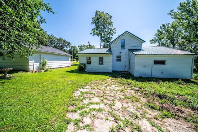 415 Minnesota Ave S, Oronoco, MN 55960 - rear view of property with a lawn and a metal roof