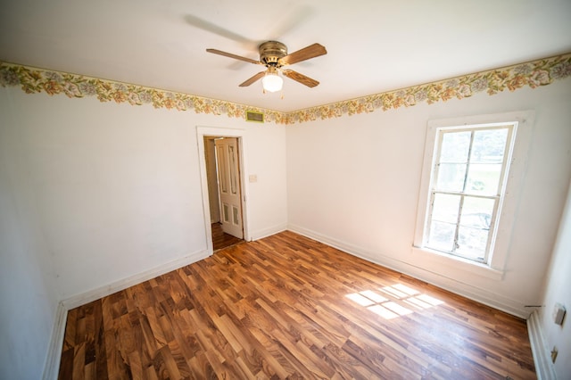 415 Minnesota Ave S, Oronoco, MN 55960 - unfurnished room featuring wood finished floors and a ceiling fan