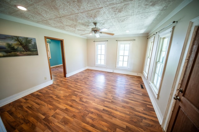 415 Minnesota Ave S, Oronoco, MN 55960 - spare room with ornamental molding, an ornate ceiling, wood finished floors, and ceiling fan