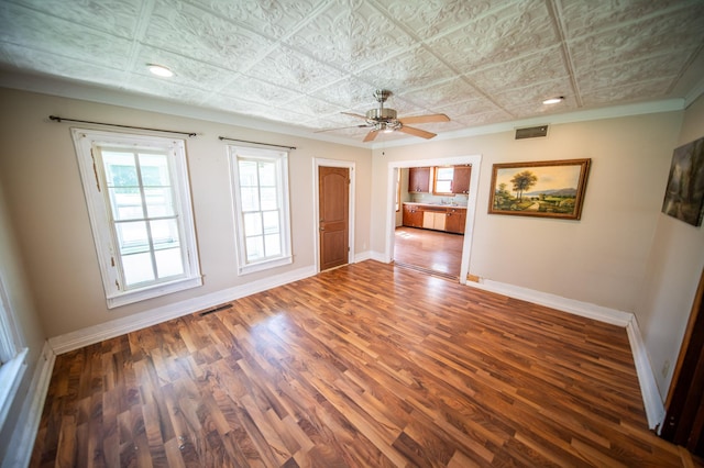 415 Minnesota Ave S, Oronoco, MN 55960 - unfurnished room featuring wood finished floors, an ornate ceiling, a ceiling fan, ornamental molding, and recessed lighting
