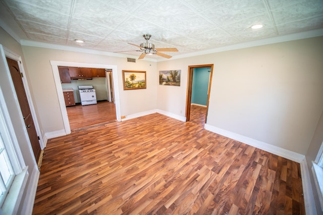415 Minnesota Ave S, Oronoco, MN 55960 - unfurnished room featuring wood finished floors, an ornate ceiling, ceiling fan, recessed lighting, and ornamental molding