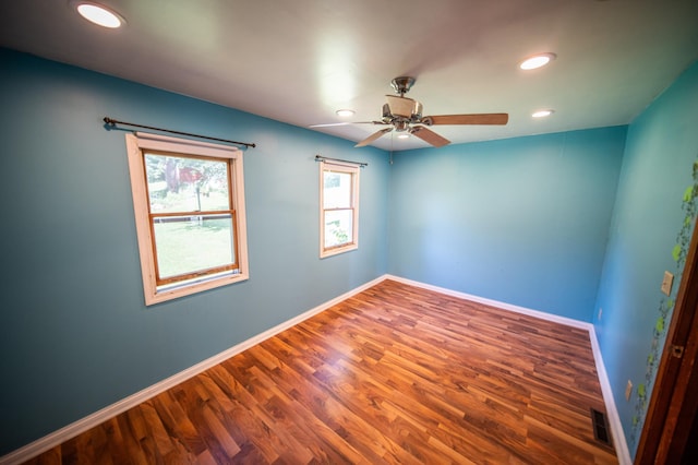 415 Minnesota Ave S, Oronoco, MN 55960 - empty room with a ceiling fan, wood finished floors, and recessed lighting