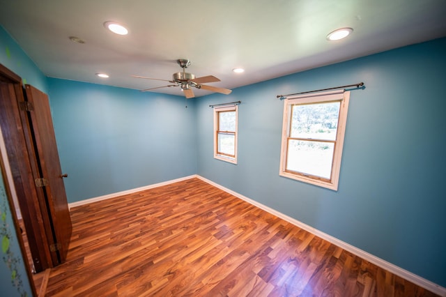 415 Minnesota Ave S, Oronoco, MN 55960 - unfurnished room featuring wood finished floors, ceiling fan, and recessed lighting