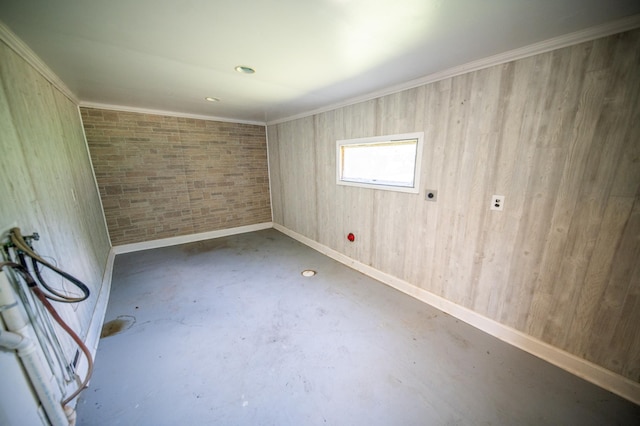 415 Minnesota Ave S, Oronoco, MN 55960 - spare room featuring unfinished concrete floors and ornamental molding