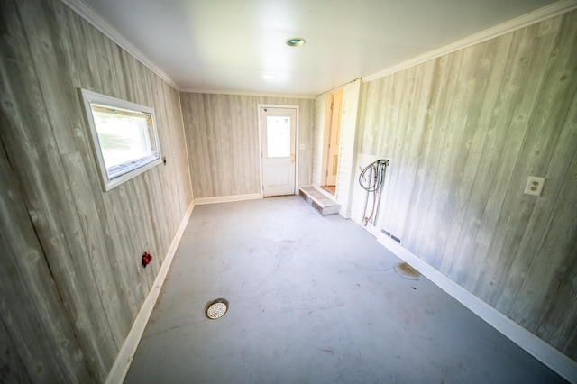 415 Minnesota Ave S, Oronoco, MN 55960 - unfurnished room featuring unfinished concrete floors, wooden walls, and ornamental molding