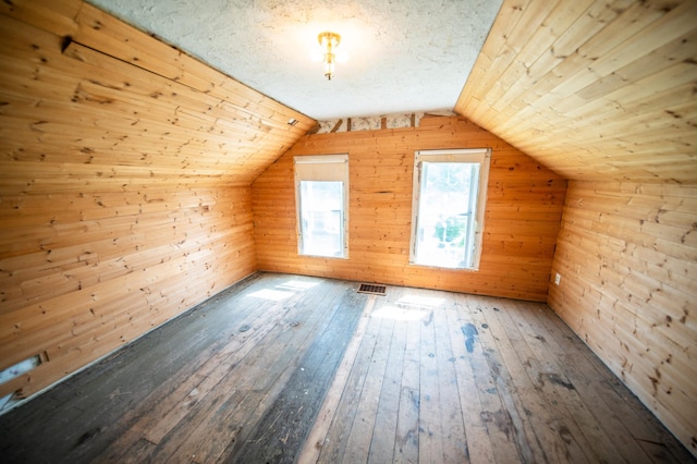 415 Minnesota Ave S, Oronoco, MN 55960 - additional living space featuring hardwood / wood-style flooring, wood walls, and vaulted ceiling