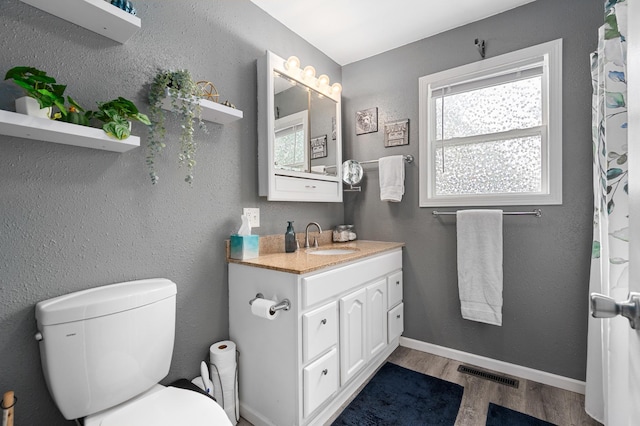 400 Mill St, Loyal, WI 54446 - bathroom featuring wood finished floors and vanity