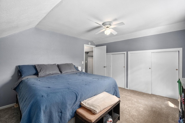 400 Mill St, Loyal, WI 54446 - carpeted bedroom with multiple closets, vaulted ceiling, and ceiling fan