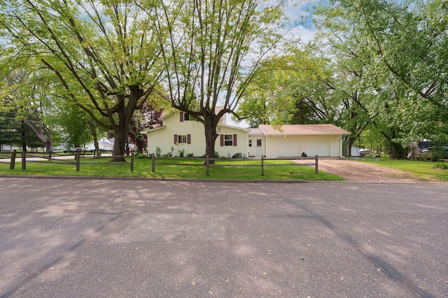400 Mill St, Loyal, WI 54446 - view of front of property featuring driveway, a front yard, and an attached garage