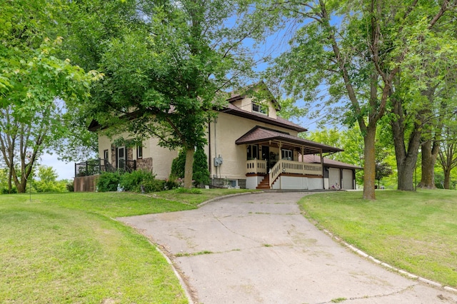 9691 Kadler Ave NE, Otsego, MN 55362 - view of front of property with a porch, a front lawn, asphalt driveway, a garage, and stairway