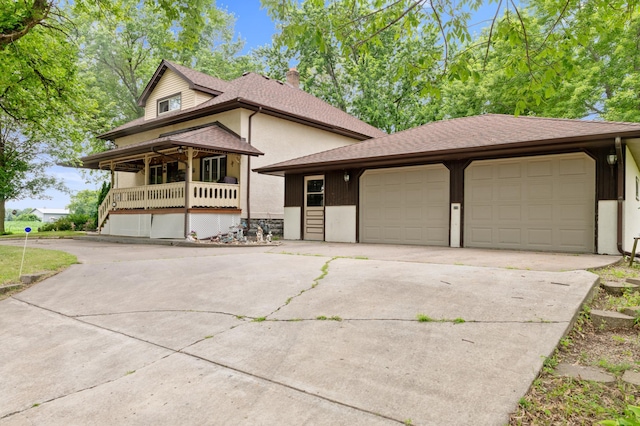 9691 Kadler Ave NE, Otsego, MN 55362 - view of front of house featuring a chimney, concrete driveway, an attached garage, covered porch, and a shingled roof