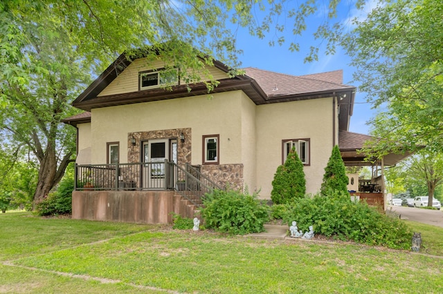 9691 Kadler Ave NE, Otsego, MN 55362 - view of front facade featuring stucco siding, a front yard, stone siding, and a shingled roof