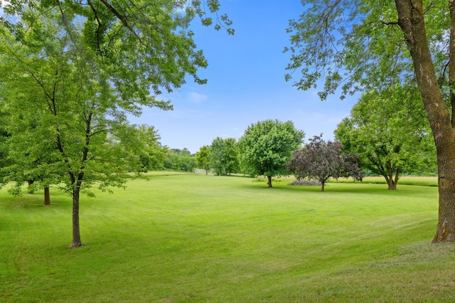9691 Kadler Ave NE, Otsego, MN 55362 - view of community featuring a lawn, golf course view, and view of wooded area