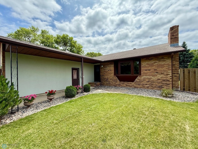 2602 Eastgate Dr S, Fargo, ND 58103 - view of front of house with a chimney and brick siding