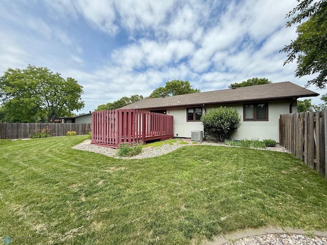 2602 Eastgate Dr S, Fargo, ND 58103 - rear view of property featuring stucco siding, a deck, and a fenced backyard