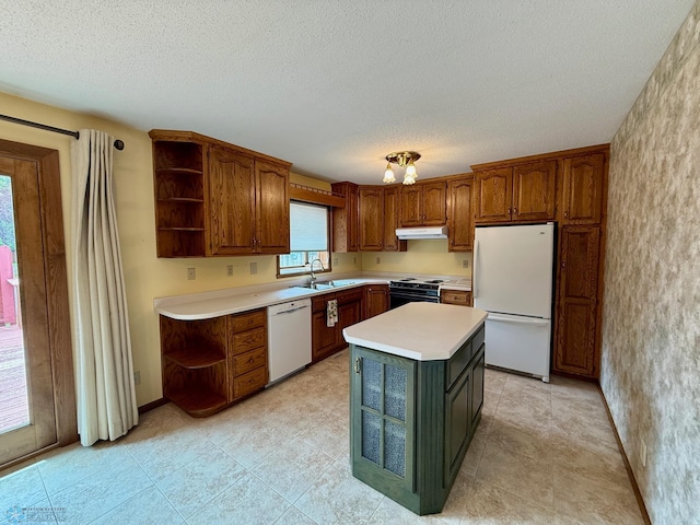 2602 Eastgate Dr S, Fargo, ND 58103 - kitchen featuring white appliances, open shelves, under cabinet range hood, light countertops, and a textured ceiling