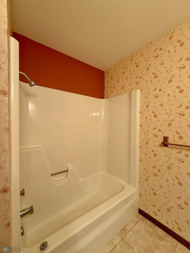2602 Eastgate Dr S, Fargo, ND 58103 - bathroom with tile patterned floors, shower / tub combination, a textured ceiling, and wallpapered walls