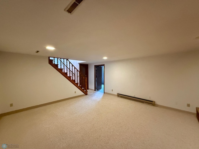 2602 Eastgate Dr S, Fargo, ND 58103 - unfurnished living room with a baseboard heating unit, recessed lighting, stairs, and light colored carpet