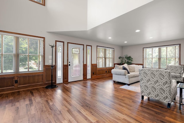 4407 Curve Ave, Edina, MN 55424 - living area featuring a wainscoted wall, wood finished floors, plenty of natural light, and recessed lighting