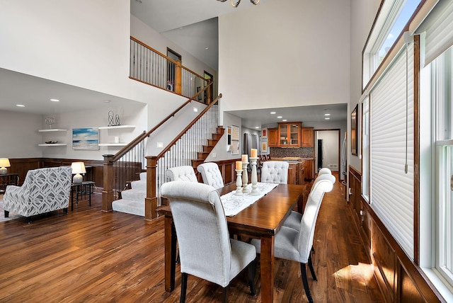4407 Curve Ave, Edina, MN 55424 - dining space with stairs, a high ceiling, and dark wood finished floors